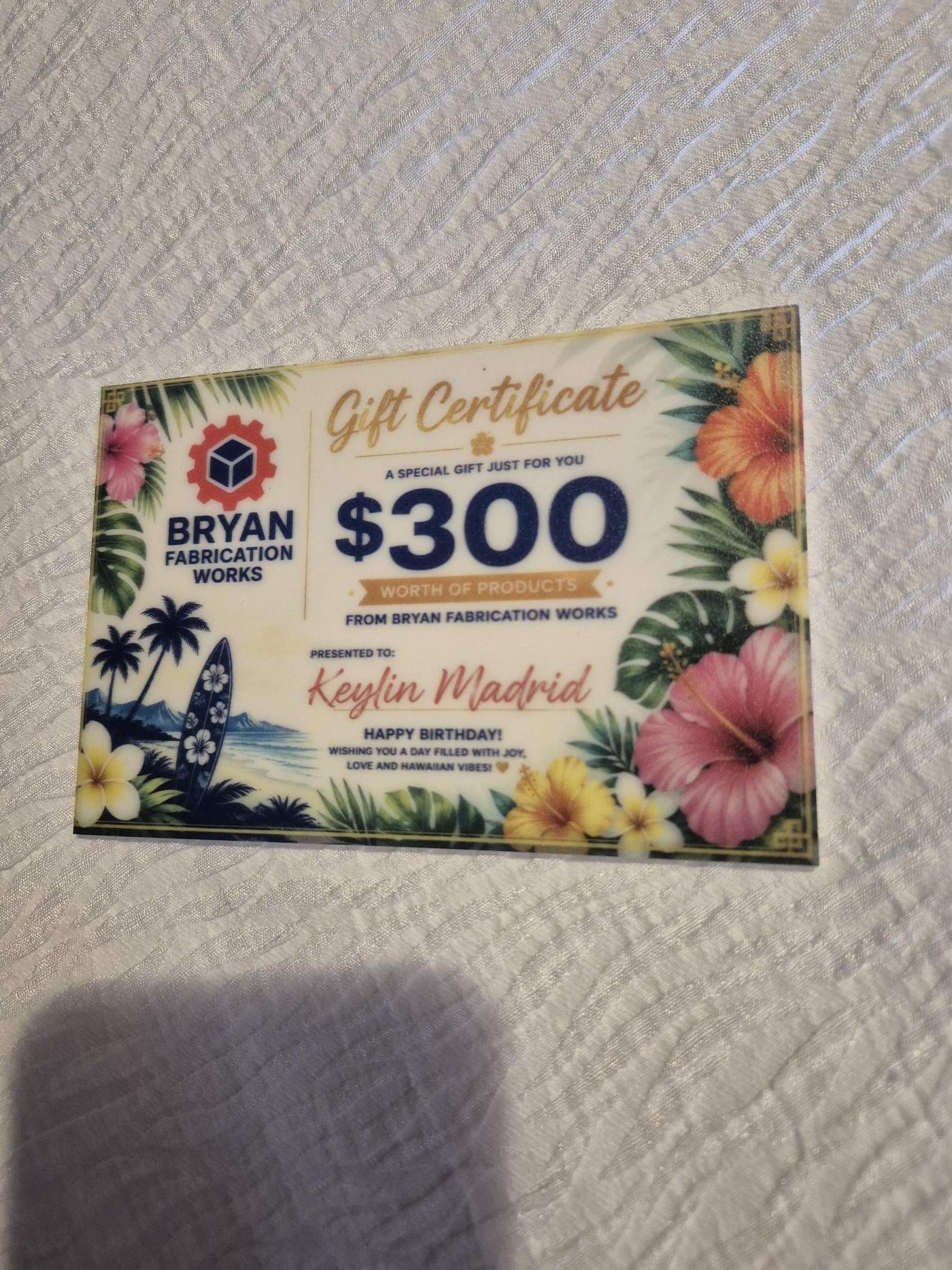 Full-color printing directly on a clear acrylic gift certificate card, the same direct-to-acrylic process we use for keepsake memorial pieces in our Tampa shop.